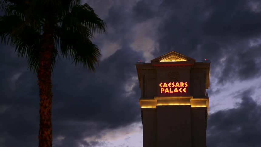 Clouds float above caesars palace at dusk