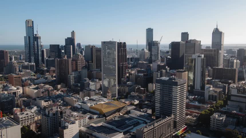 Skyscrapers stand in a city on a clear day