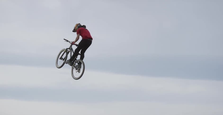 Man performs a trick on a bicycle
