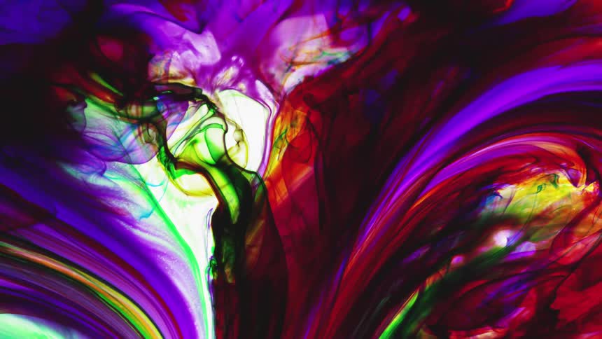 Multi-colored liquid rotates and swirls together