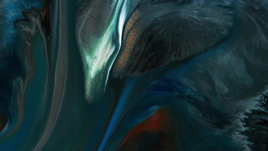 Glittery paint ripples and flows