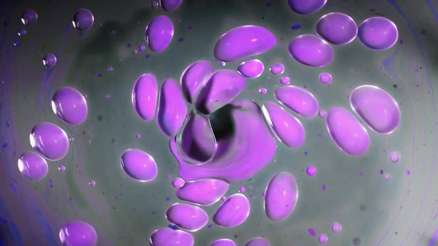 Colorful globs spinning in a circle in a liquid form