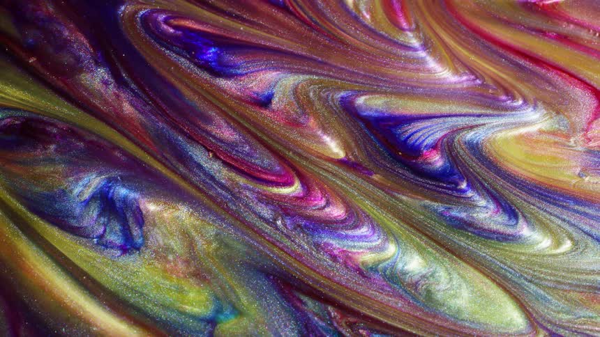 Multi-colored liquid rotates and swirls together