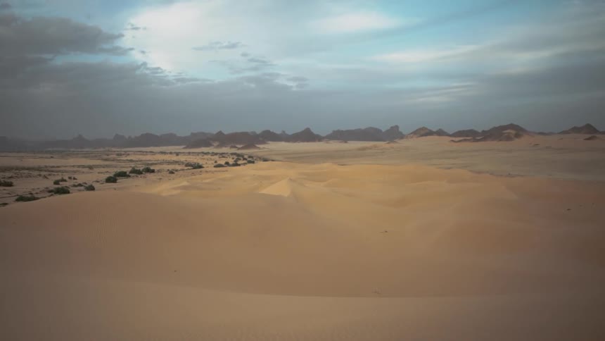 Clouds float over a desert