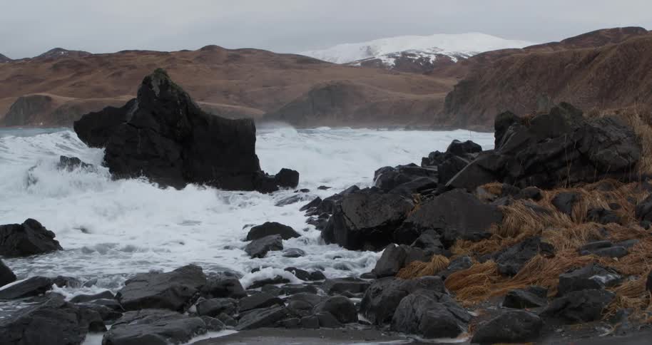 Waves flow onto the rocky shore