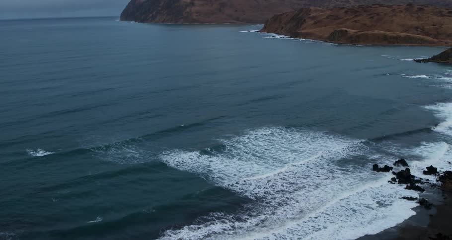 Ocean waves wash ashore a beach
