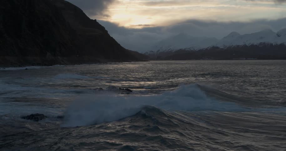 Waves flow onto the beach shore