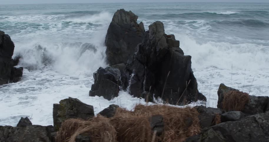 Waves break onto the rocky shore