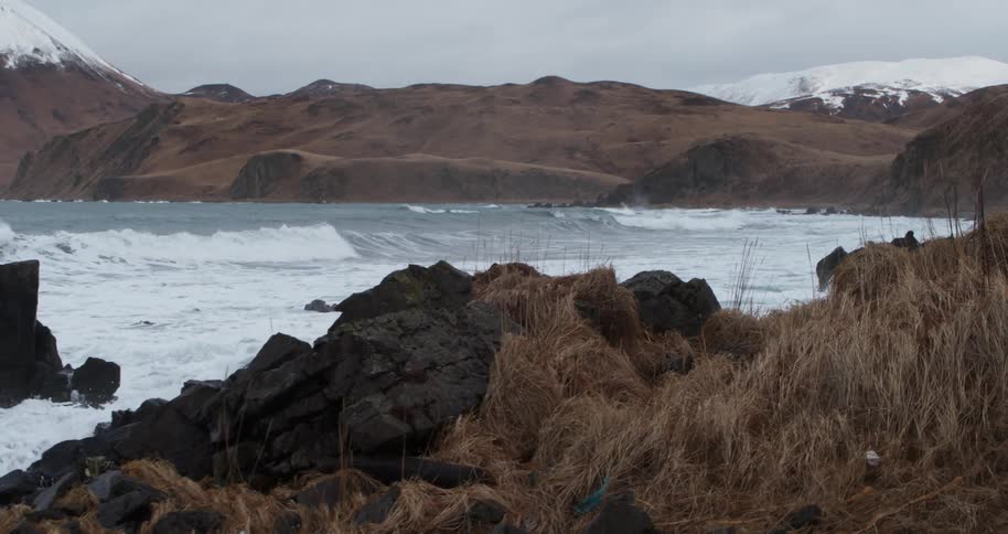 Waves flow onto the rocky shore