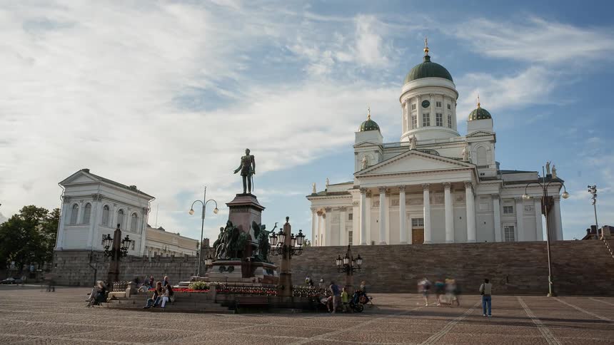 People visit and photograph a church and tourist attraction