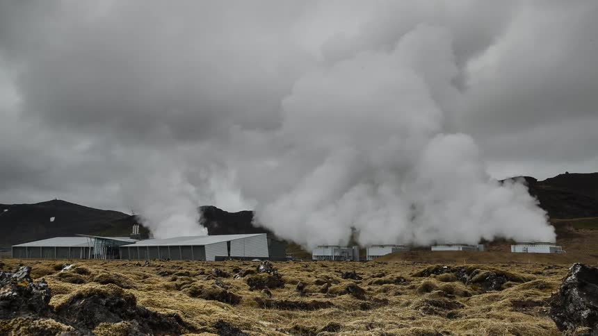Smoke rises from rural buildings