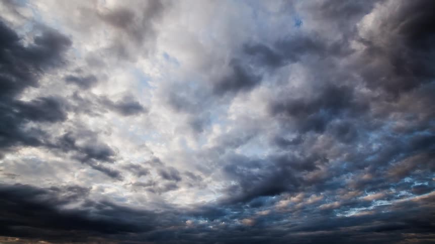 Clouds darken as they move across the sky