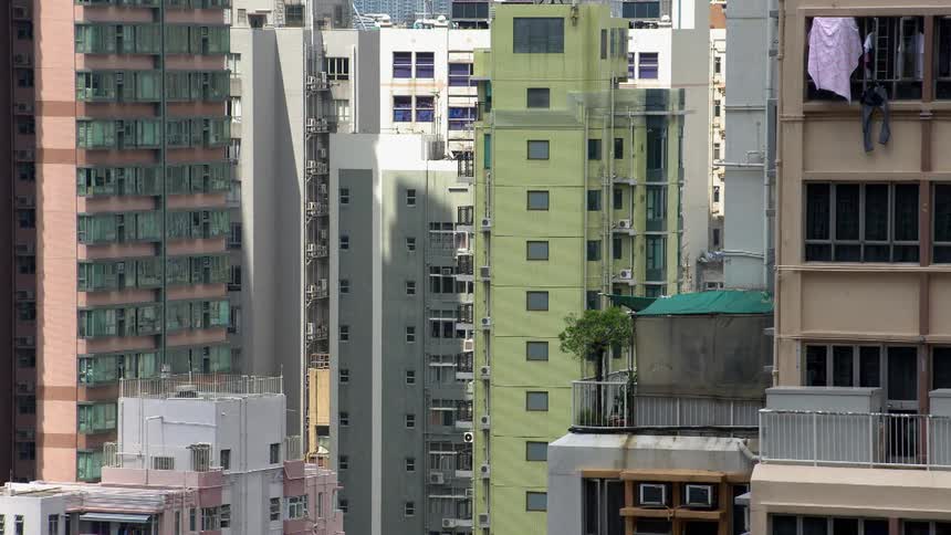 Sheet hangs from a balcony window
