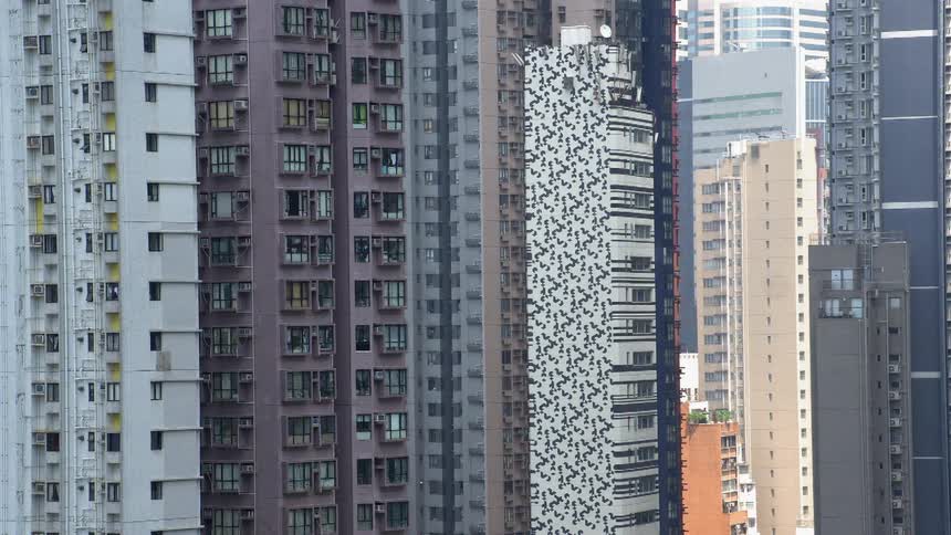 Tall apartment buildings tower into the sky