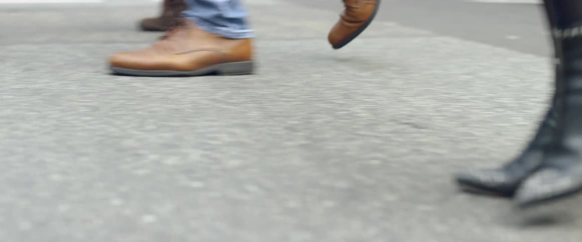 Pedestrians cross a city street