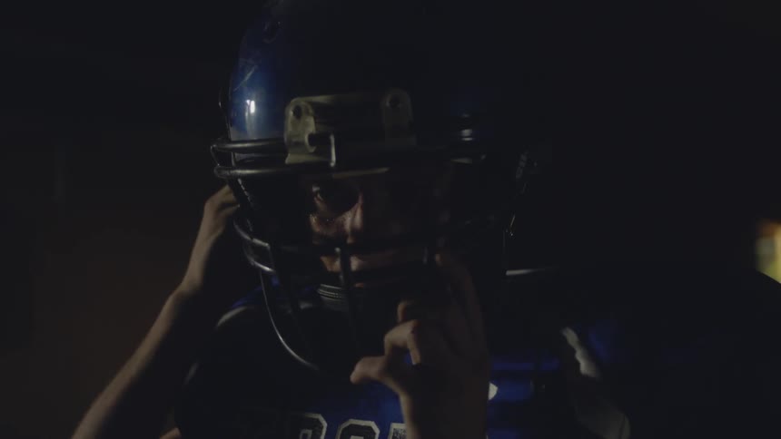 A person putting on a helmet