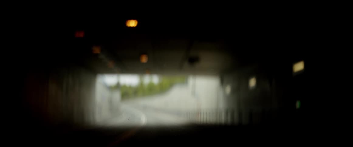 A car drives through a city tunnel