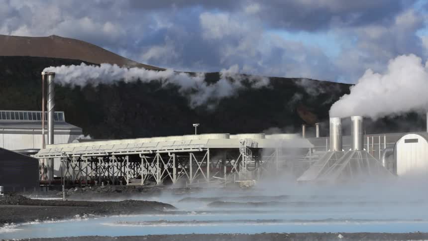 Smoke rises from factory smokestacks