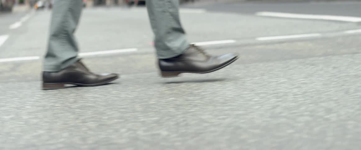 Pedestrians cross a city street