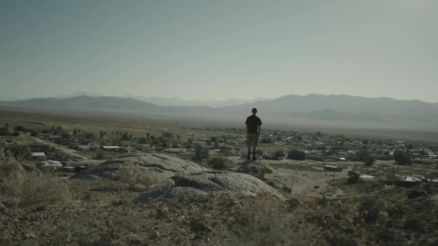 A person standing on a rock