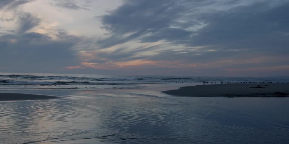 Ocean water ripples at sunset
