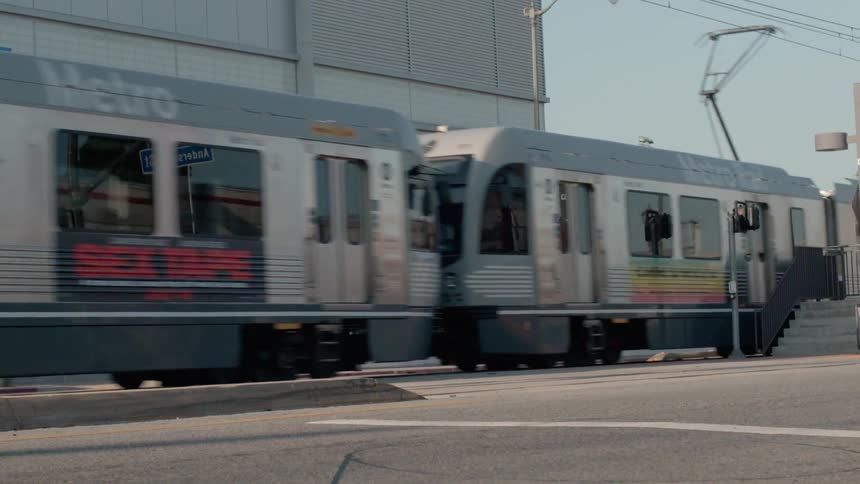 A passenger train travels in a city