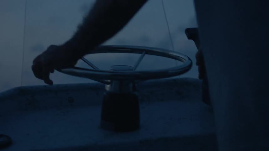 Person steering a boat