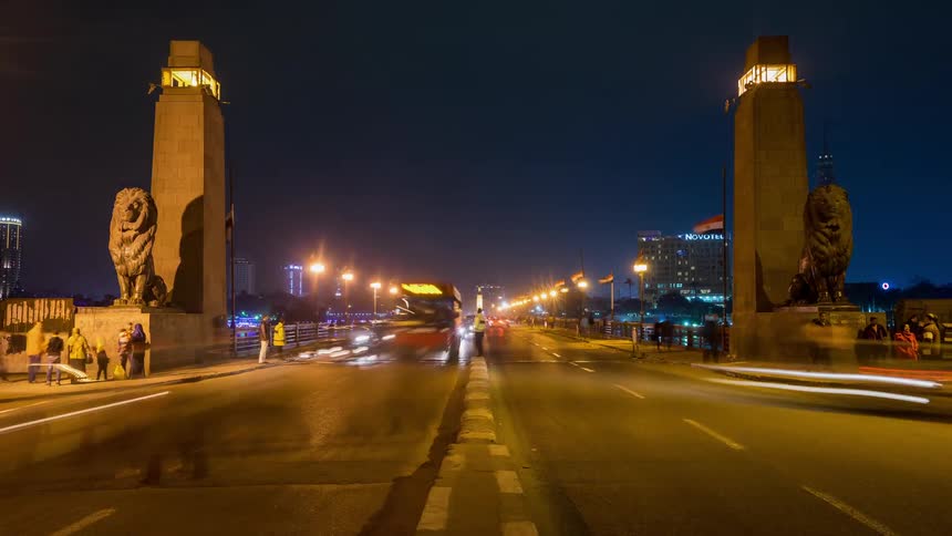 Cars driving down a street through a middle eastern city