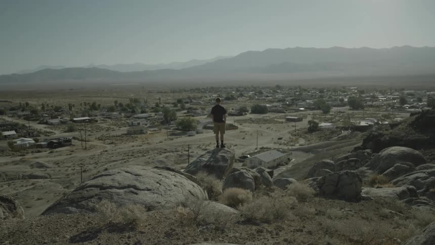 A person standing on a rock