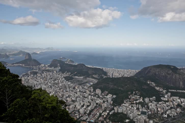 Clouds float over a coastal city
