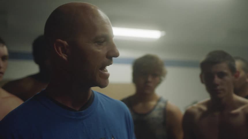 Athletes train vigorously in a gym