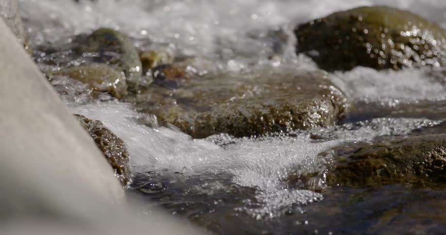 Water splashes in a rocky stream