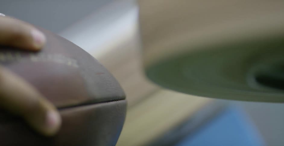 A football is fed through a football machine