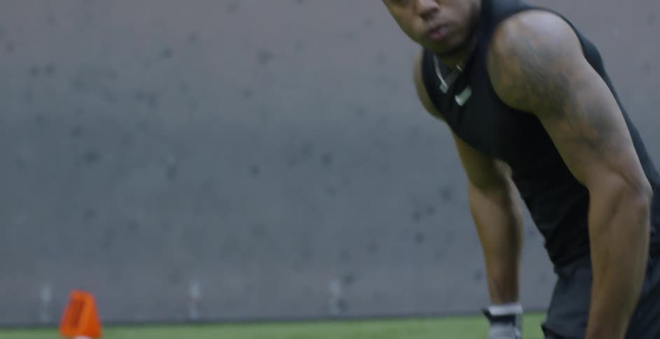 A man sets at the line and gets ready to run