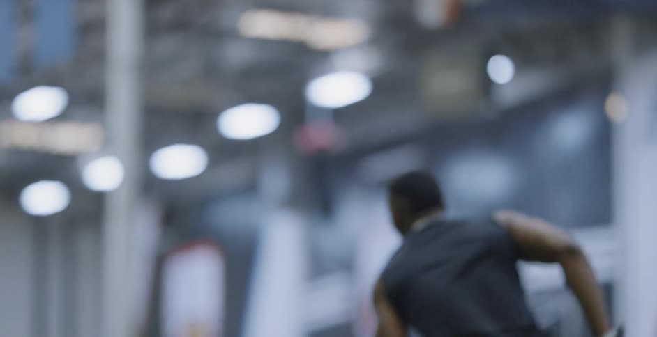 A football player trains indoors
