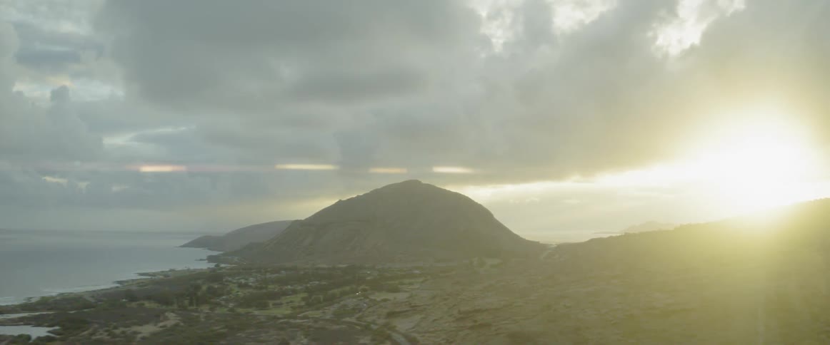 Clouds gather over an island