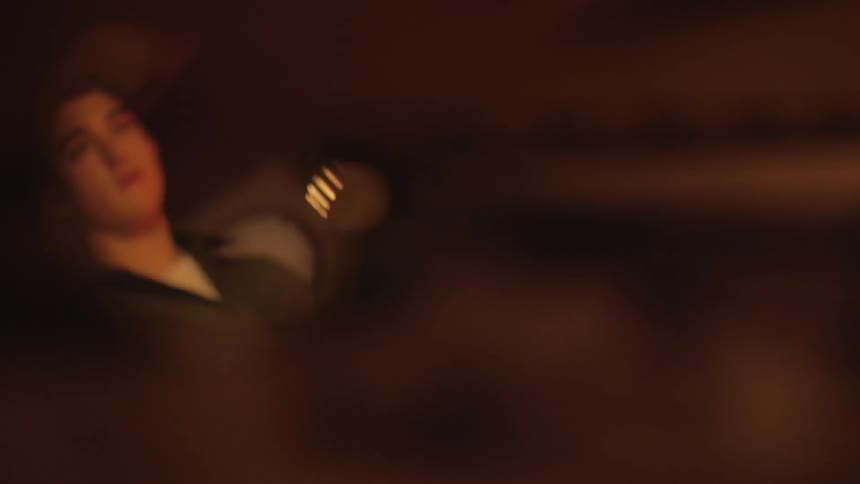 A persons reflection in glass