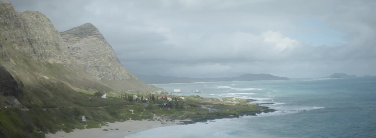 Ocean waves flow around the coastline