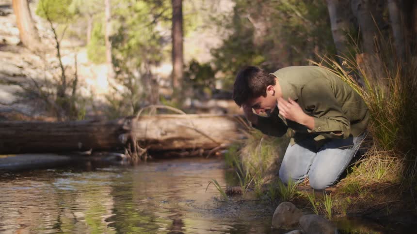 A man is gathering water