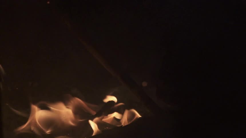 Fire burning in a dark area