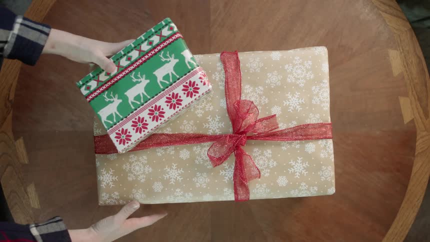 Christmas presents are removed from a table