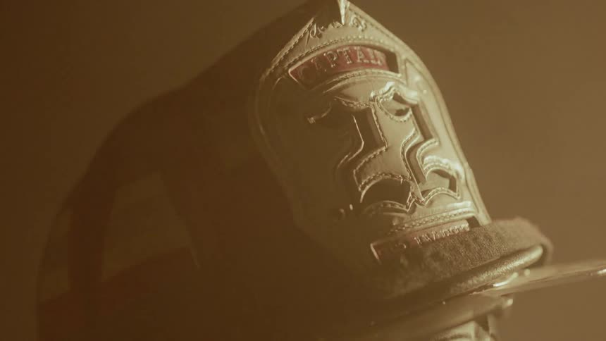 Light shines on a firefighter's helmet