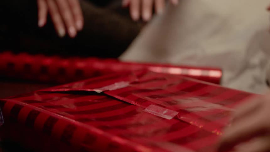 A family wraps a present