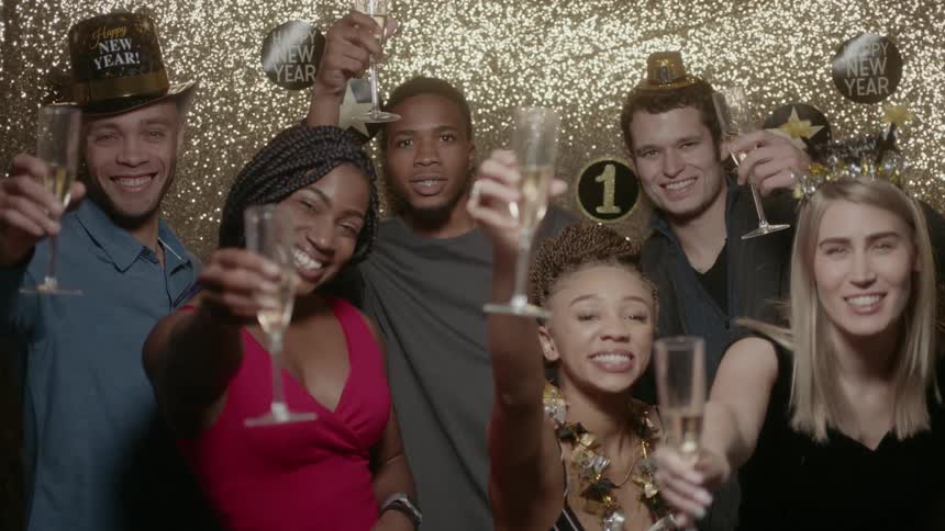 Friends celebrate the new year with champagne