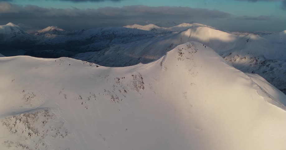 Snow covers a mountain ridge
