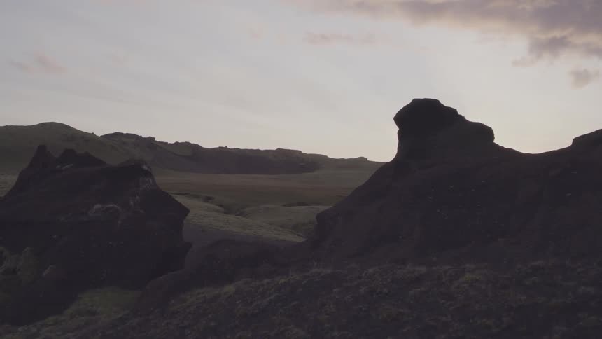 The sun sets over mountains