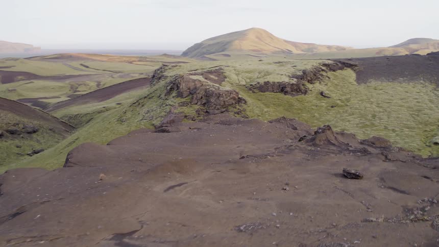 The range is full of many small green hills