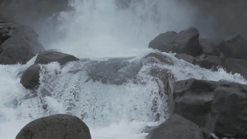 A waterfall rolling down a cliff side