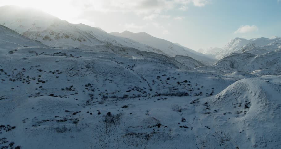 Snow covered mountains under a blue sky