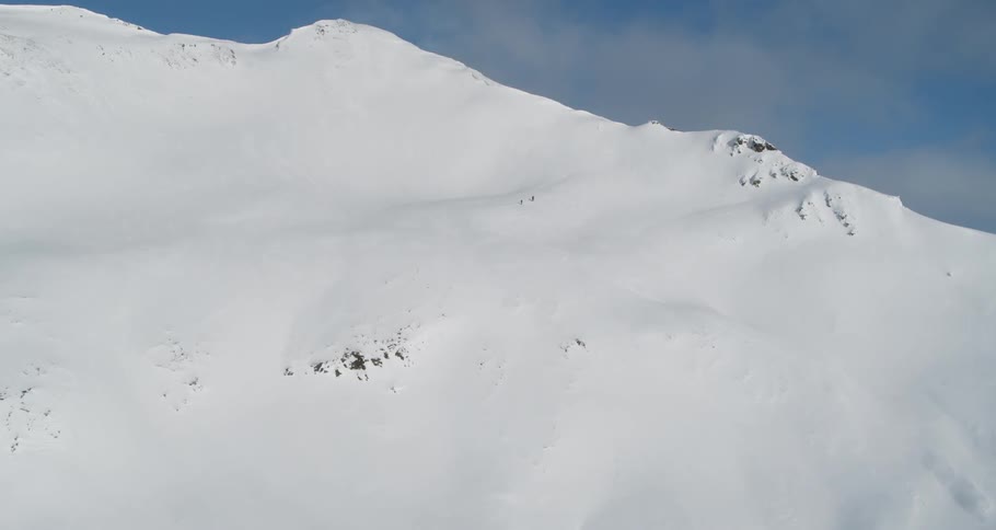 Snow covers a mountainside